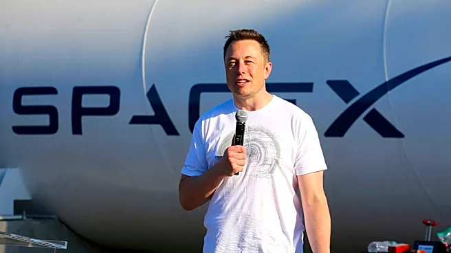 SpaceX opens at $150 per share in Nasdaq debut, below initial $175 indication