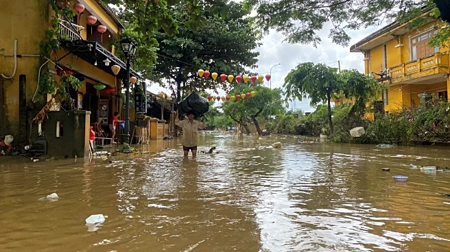 Vietnam floods kill 41 as record rain sweeps away bridge, leaves families stranded on rooftops