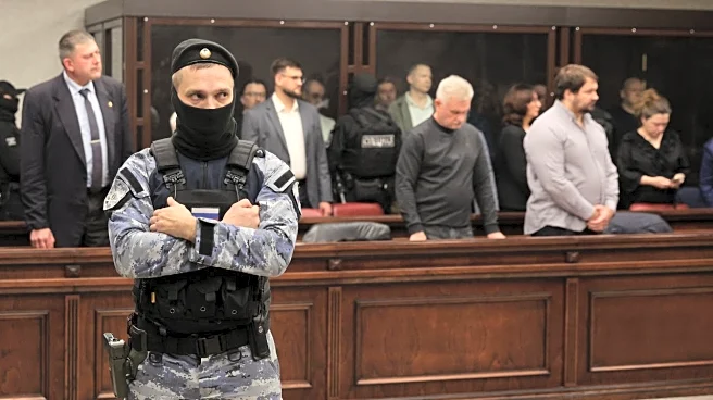 Russia hands life sentences to 8 people over attack on key bridge to Crimea