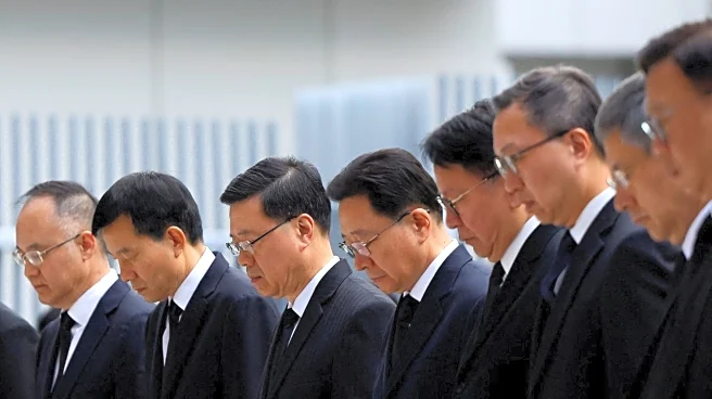 Hong Kong mourns victims of blaze that killed 128 and counting