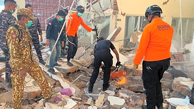 Indonesia earthquake kills at least 20, collapses buildings and triggers tsunami warning