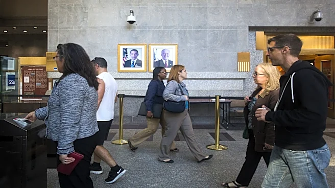 US jobless claims fall to lowest level since July as layoffs remain low