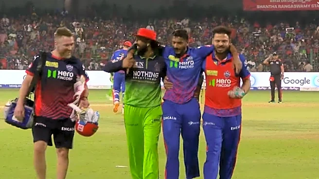 RCB's Krunal Pandya escorts DC skipper Axar Patel off-field after latter gets retired hurt