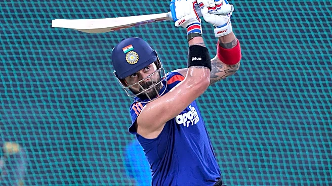 Virat Kohli signs autograph on net bowler's India jersey at Brabourne Stadium