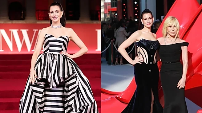 Anne Hathaway In Versace Tuxedo Gown Poses With Donatella Versace On Red Carpet