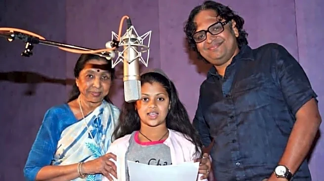 Who was Hemant, Asha Bhosle's son, who succumbed to cancer?