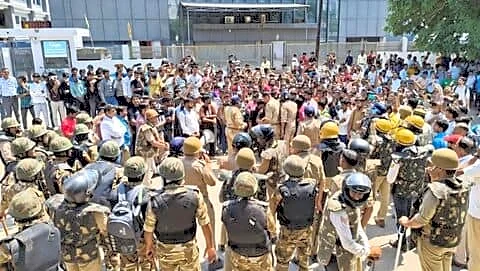 Noida workers protest after Haryana announced 35% wage hike