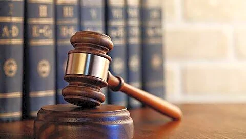 Supreme Court says criminal cases must end after loan settlements