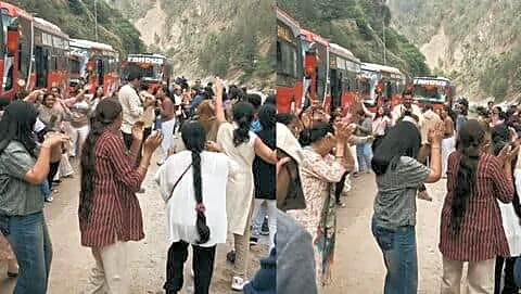 Gujarati tourists dance garba beside landslide-blocked hill road, vehicles stranded