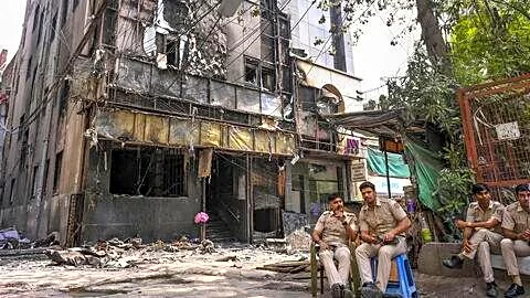 Delhi fire leaves families waiting to claim bodies and belongings
