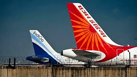 Heavy rain delays Delhi and Mumbai flights as airlines warn