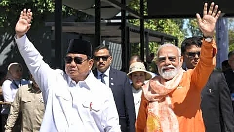 Narendra Modi receives angklung from Prabowo Subianto in Jakarta
