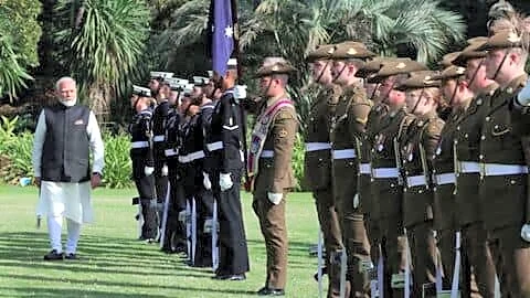 Prime Minister Narendra Modi lands in Melbourne, receives honor guard