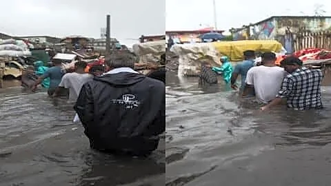 Family in Surat wades knee deep floodwater to cremation ground