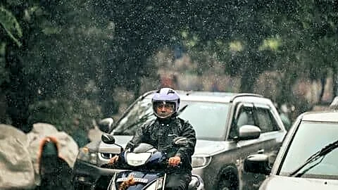 Sudden afternoon downpour floods Hyderabad neighborhoods and slows traffic