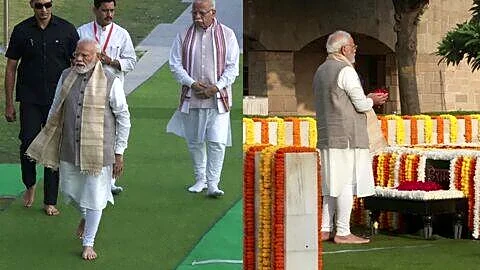 Narendra Modi pays tribute to Mahatma Gandhi at Raj Ghat