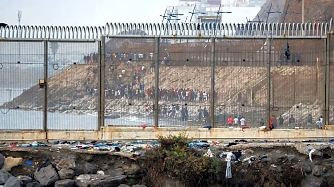 Spain begins installing floating barrier after massive migrant influx