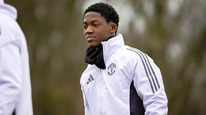 Why is Kobbie Mainoo not included in Manchester United's squad?