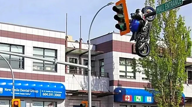 Bizarre Canada Crash - Suzuki GSX-R1000R Ends Up Hanging From Traffic Light After Collision