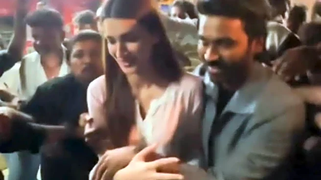 Dhanush Protects Tere Ishk Mein Co-Star Kriti Sanon As They Get MOBBED At Mumbai's Iconic Gaiety Galaxy - Watch