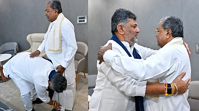 DK Shivakumar Hugs Siddaramaiah, Touches His Feet - Photos