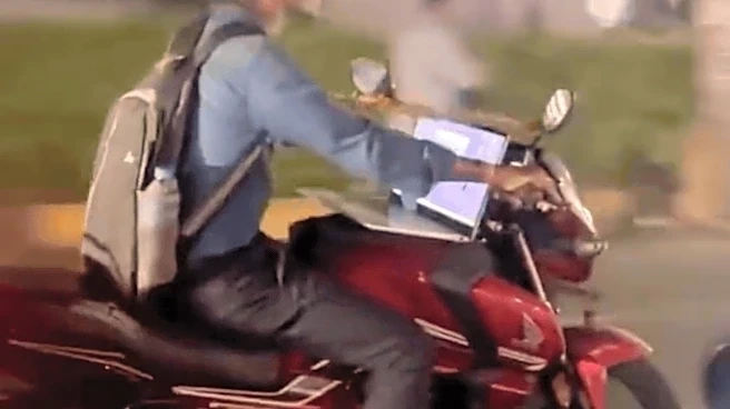 Hyderabad's 'Work From Bike' Moment: Man Uses Laptop While Riding Bike - WATCH