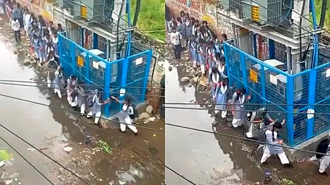 Waterlogged Delhi Road Forces Schoolgirls To Hold Onto Electricity Transformer Grill While Walking | Viral Video