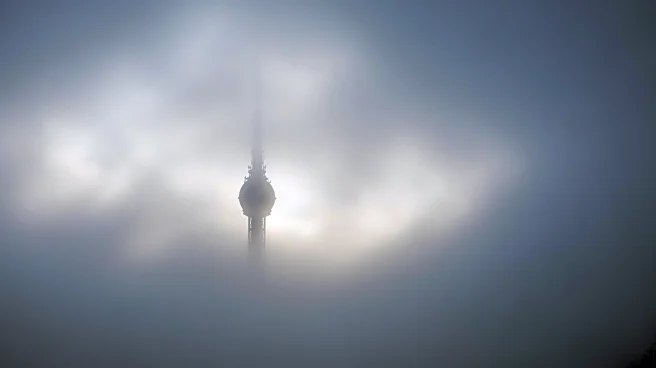 Fog Envelops Seattle's Space Needle, Reducing Visibility