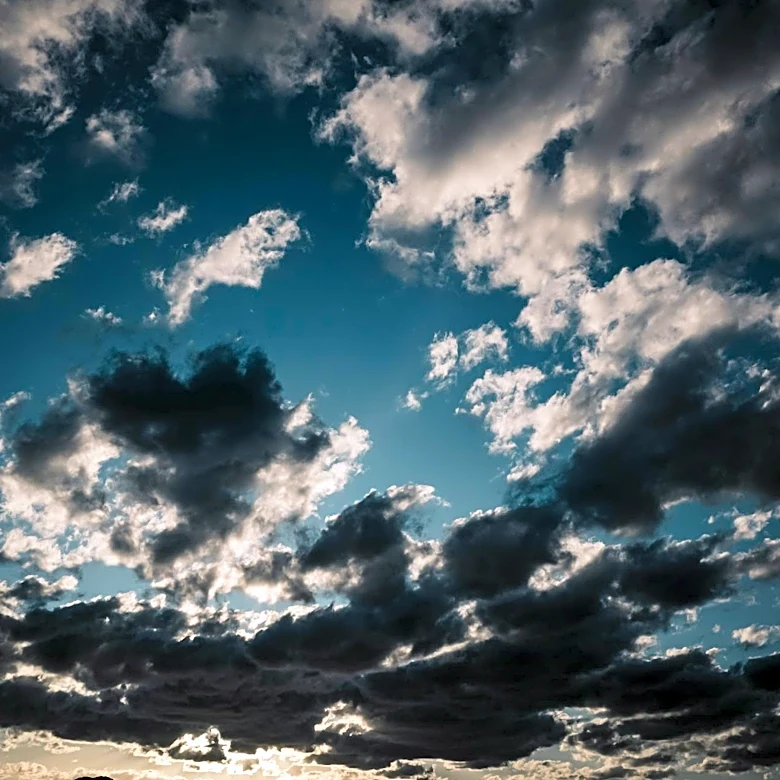 Evening Weather Update: Scattered Sprinkles and Partly Cloudy Skies