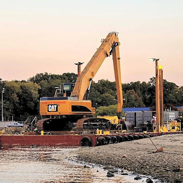 Dredging Operations Underway in Harwich Harbors Amid Weather Challenges