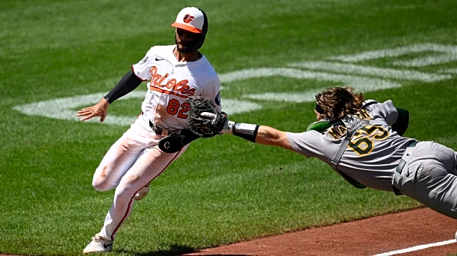Willie MacIver hits a 2-run double in the 9th to rally Athletics over Orioles