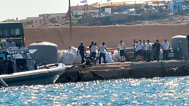 A boat carrying migrants capsizes off Italy, killing at least 26