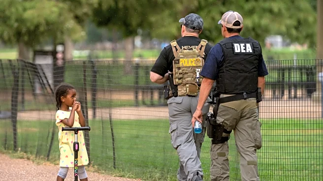 The Latest: Dozens arrested in Washington as White House ratchets up federal police presence