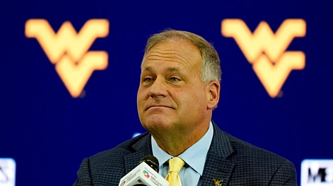 A new generation learns Rich Rodriguez's demanding coaching style at West Virginia