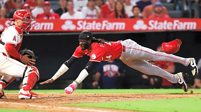 Lux hits 2-run homer and Singer pitches triple-happy Reds to 4-1 win over Angels