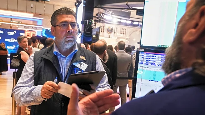 Wall Street hovers near records as markets take in earnings ahead of Powell speech Friday