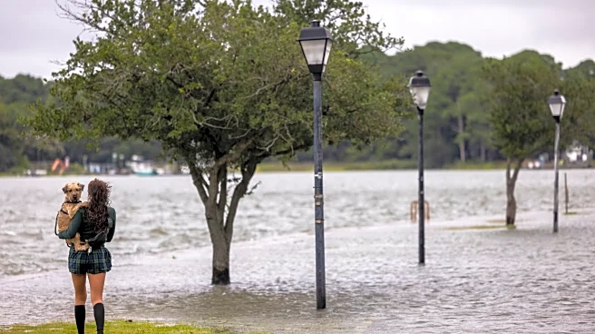 Hurricane Erin leaves rough seas with 2 swimmers dead and a search underway for a missing boater