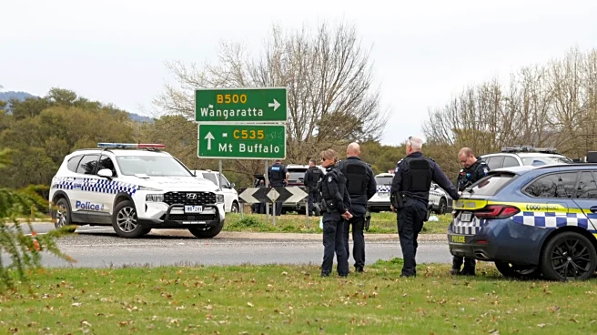Australian police hunt for gunman who killed 2 officers and shot another in a rural town