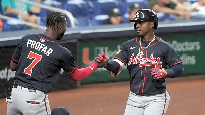Albies hits 2 HRs, Braves uses 9-run 9th to beat Marlins 11-2