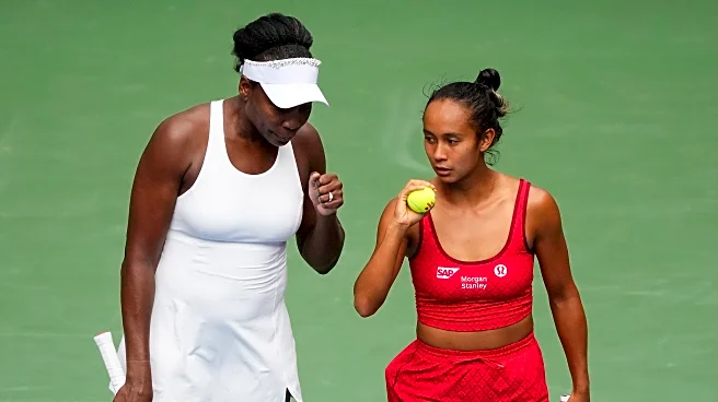 Venus Williams wins a US Open women's doubles match for the first time since 2014