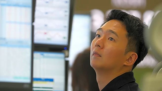 Asian shares are mixed after stocks add a bit to their records on Wall Street