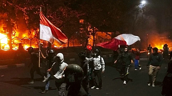 At least 3 dead after mob sets fire to Indonesian regional parliament building