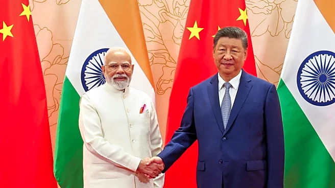 China's Xi and India's Modi vow to resolve border differences at meeting in Tianjin