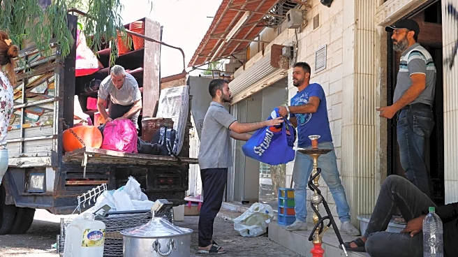 Alawite families flee Damascus suburb after violence and eviction threats