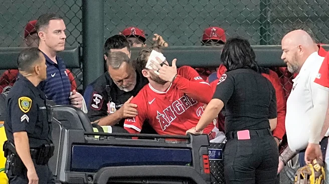 Angels' Taylor Ward carted off field after crashing into scoreboard