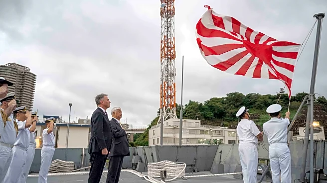 Australia's defense minister visits a frigate in Japan as the countries boost defense ties
