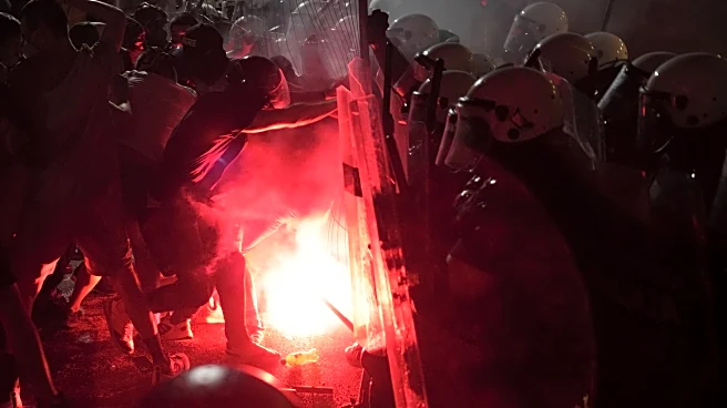 Tear gas is fired in Serbia at thousands of protesters demanding free elections and justice