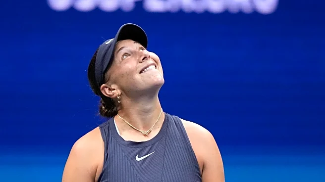 Anisimova struggles to serve with Arthur Ashe Stadium's roof closed during the US Open final