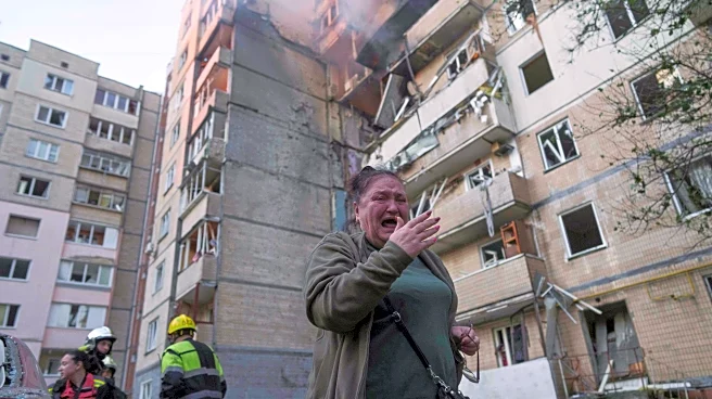 Ukraine government building damaged in Kyiv in the largest Russian attack since the war began