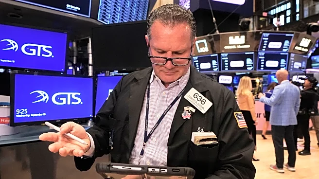 Wall Street inches up to more records as inflation slows and Oracle soars